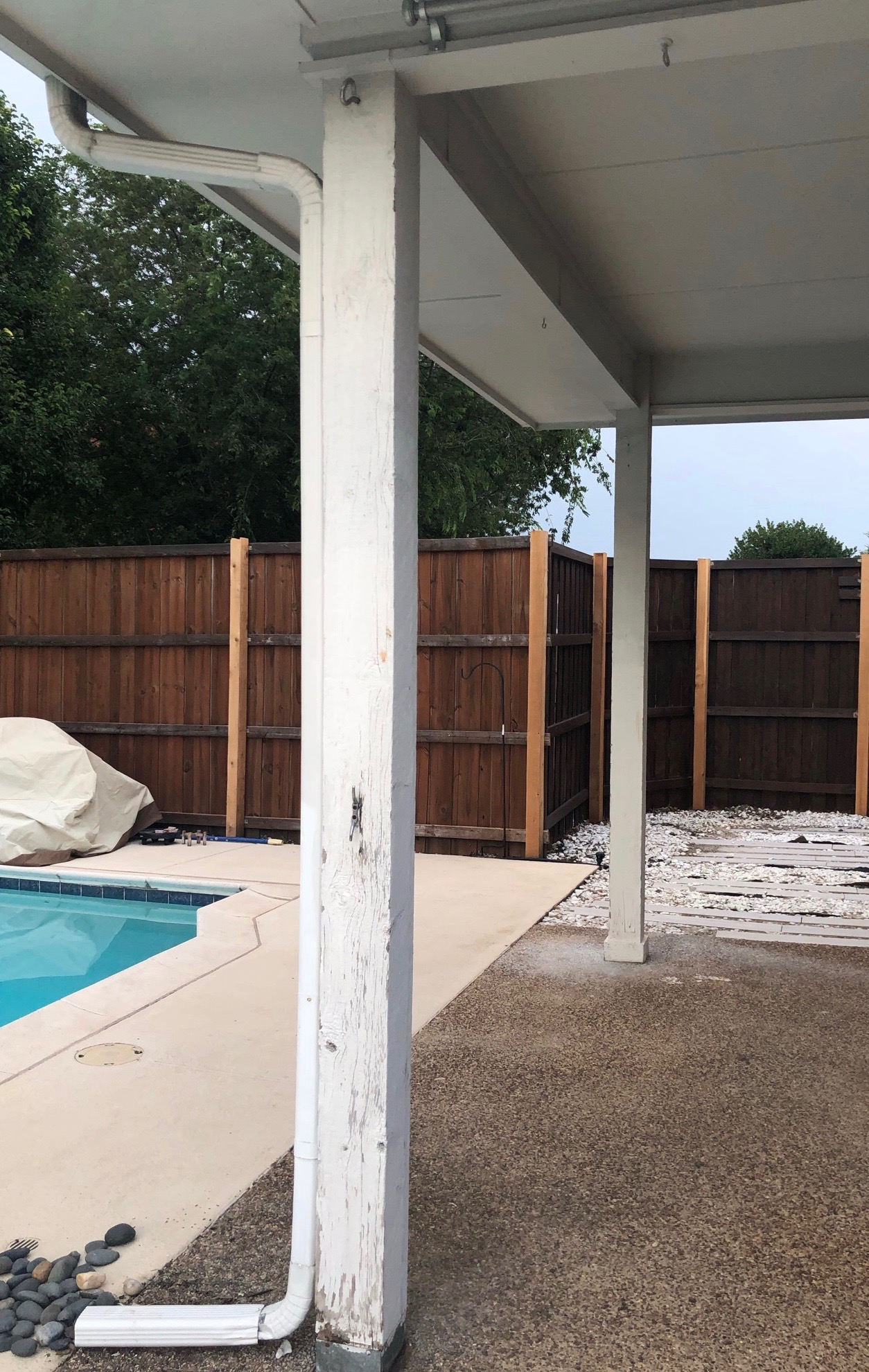 Wood porch posts before removal — M.A. review photo