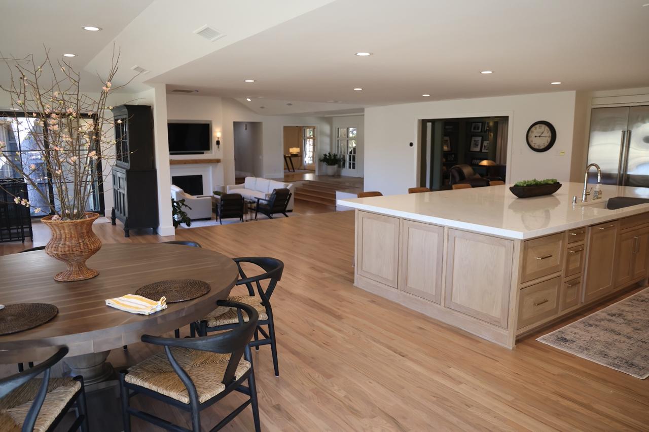 Kitchen remodel before and after — open concept kitchen island after removing load bearing wall