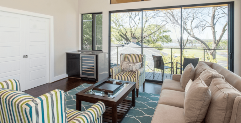 Glass wall to door installation creating indoor-outdoor living space in Texas